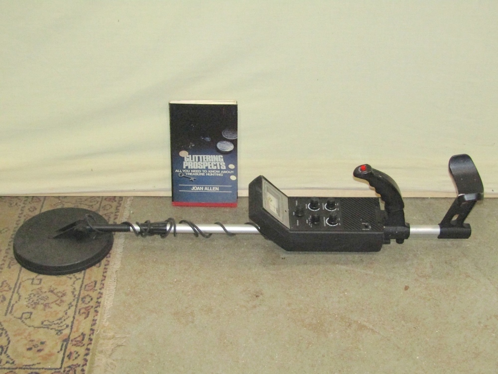 A Discriminator Metal Detector model 3006, used but in original cardboard packaging, together with a