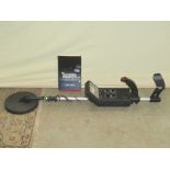 A Discriminator Metal Detector model 3006, used but in original cardboard packaging, together with a