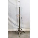 A art nouveau period brass telescopic oil lamp standard, the simple tubular stem with whiplash