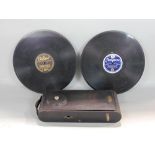 A Thorens miniature travel gramophone with Swiss patent with two 78 records