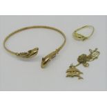 Group of 9ct novelty dolphin jewellery comprising diamond set bangle, a pendant necklace and ring,
