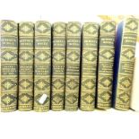 Dicken's Works in eight volumes published by Chapman & Hall, London with ornate gilt decorated