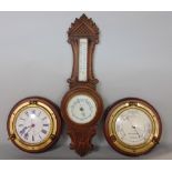 Carved oak mercury barometer/thermometer, 56cm high, together with two bulkhead type time pieces (