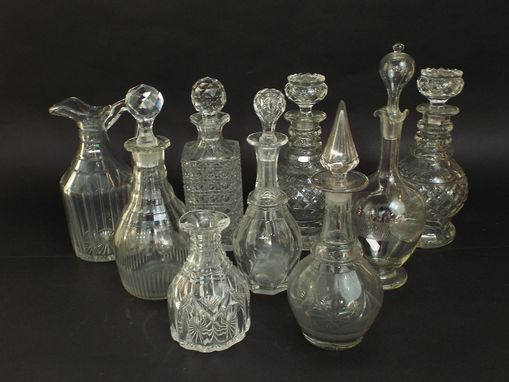 A collection of nine 19th century and later decanters to include a pair of hob nail cut decanters