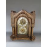 Late 19th century oak Arts & Crafts ecclesiastical board room clock, the architectural case with