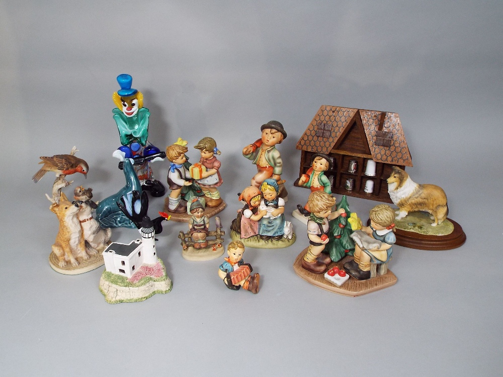 A collection of Goebel figures and groups including Decorating the Tree BH75, A Present For You