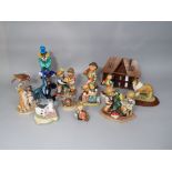 A collection of Goebel figures and groups including Decorating the Tree BH75, A Present For You