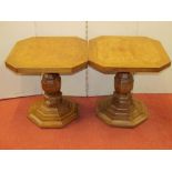 A pair of oak and walnut occasional tables, the octagonal tops raised on octagonal vase shaped