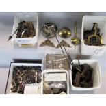 Five tubs containing a collection of miscellaneous clock bits to include hands, gongs, gut,