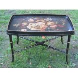 A regency style occasional table, the detachable tray top with painted floral detail, raised on a