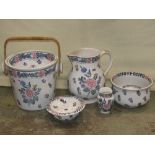 A part white glazed ceramic Bristol pottery jug and basin set with floral detail