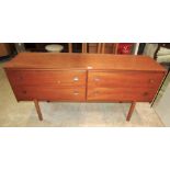 A retro teak veneered long and low dressing table, fitted with four drawers (side by side