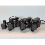 Four pairs of Busch binoculars to include three pairs of Sollux 8x30 all with crown markings plus an