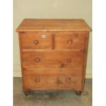 A small Victorian stripped pine linen/grain bin in the form of a chest of two short and two long