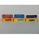 Three Dinky Toys including two Duple Roadmaster Coaches 282 and a B.O.A.C. Coach 283, all in