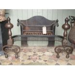 A good quality Georgian style burnished steel fire basket with shaped outline pierced fretwork