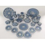 A quantity of blue ground Wedgwood Jasper wares including trinket boxes and covers, oval tray,