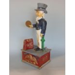 Cast metal Uncle Sam money box, in working order, 28cm high