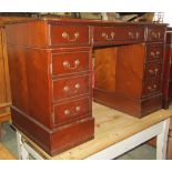 A contemporary kneehole twin pedestal mahogany veneered computer desk in the Georgian style, with