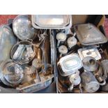 Two boxes containing a large quantity of silver plate to include chocolate pots, caddies,