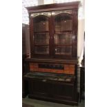 A Victorian mahogany secretaire bookcase, the upper recessed section enclosed by a pair of arched