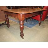 A Victorian mahogany dining table with moulded outline and turned supports (fixed top, adapted)