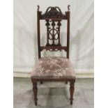 A set of four Edwardian Art Nouveau style dining chairs with moulded frames, carved cresting rails