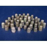 A collection of 42 silver and white metal thimbles, 6oz approx (42)