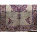 Interesting Indian carpet with colourful Islamic medallions/panels upon a fawn ground, 300 x 220cm