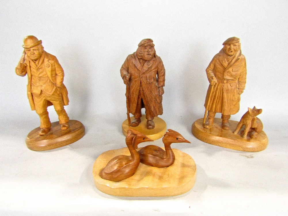 Four good English treen figures to include and old war veteran, with trench coat and war medals,