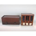 Interesting folk art/apprentice type cabinet of small proportions with central hinged door framed by