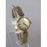 Ladies Rodania 9ct cocktail watch upon 9ct honeycomb strap, the champagne dial with baton makers,