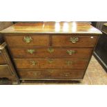 A Georgian Countrymade oak chest of three long and two short drawers, with pierced brass plate