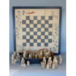 The Lewis Chess Set, together with interesting chess board made of terracotta tiles