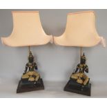 Matched pair of eastern cast bronze and gilt metal, (possibly ormolu) figural table lamps in the