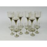 A set of six Holmegaard smoked glass wine glasses together with a matching set of six liquor glasses