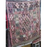 Antique Kelim rug with typical geometric decoration, upon a red and washed red ground, 160 x