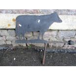 An iron work weather vane, the cut sheet steel metal finial in the form of a cow, 60 cm in height