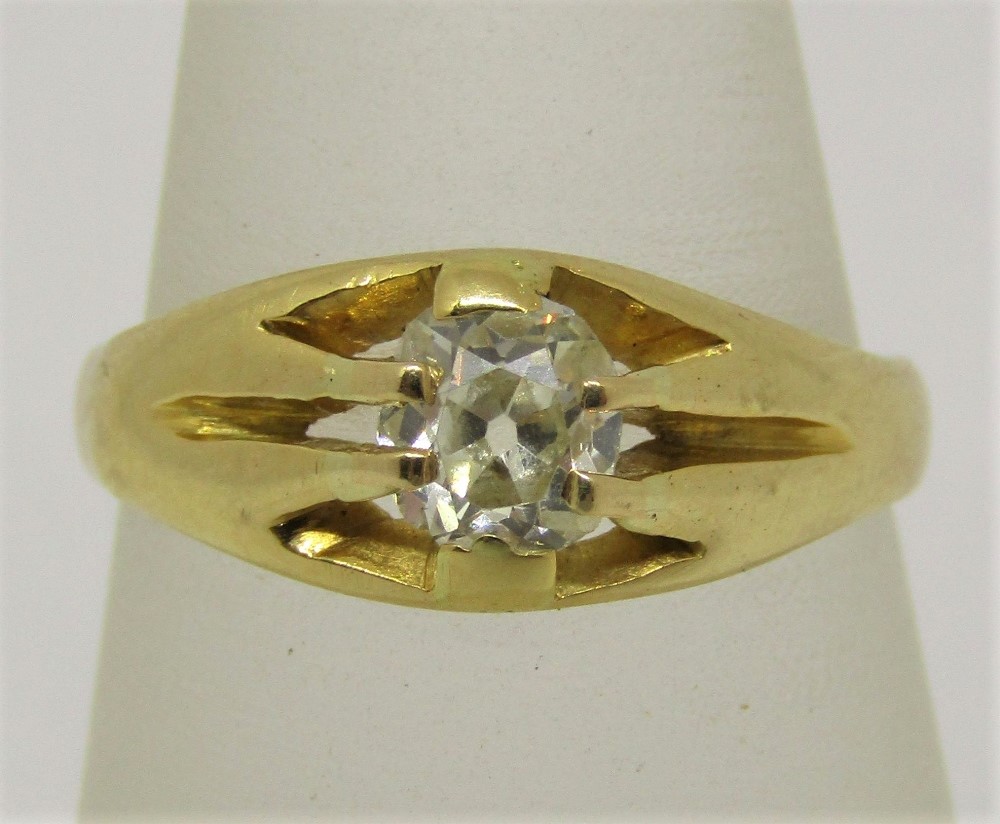 Diamond solitaire gypsy ring in unmarked yellow metal, the old cut stone 0.40cts approx, size L/M,