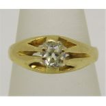 Diamond solitaire gypsy ring in unmarked yellow metal, the old cut stone 0.40cts approx, size L/M,