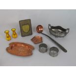 A box containing a collection of mainly arts and crafts metal wares to include two copper pin trays,