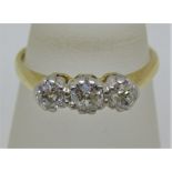 18ct three stone diamond ring, centre stone 0.20cts approx, size M/N, 2.9g