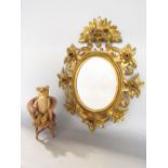 Venetian style gilt wood oval wall mirror, the frame carved with various flowers and wheat sheaf,