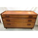 A White & Newton low teak bedroom chest of two short and two long graduated wide drawers, 127 cm