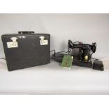 Singer no 221k portable electric sewing machine, with foot pedal, travel case and instruction book