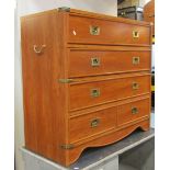 A contemporary bedroom chest in the military/campaign style of four long drawers, the lower