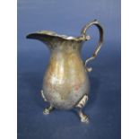 Early 20th century Georgian style baluster cream jug, with S scroll handle and scallop shell hoof