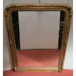 19th century gilded overmantle mirror, the arched frame with moulded trailing floral repeating