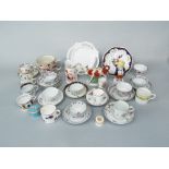 A collection of late 18th and early 19th century tea bowls and saucers, trios, etc, including