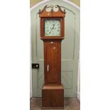 An early 19th century and walnut crossbanded longcase clock, the square cut painted dial with